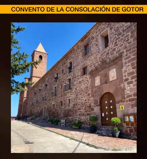 Vista exterior del Convento de la Consolación de Gotor, mostrando la torre y el edificio de piedra.